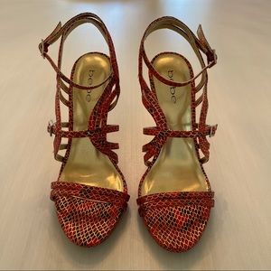 Bebe red/orange stiletto heel.